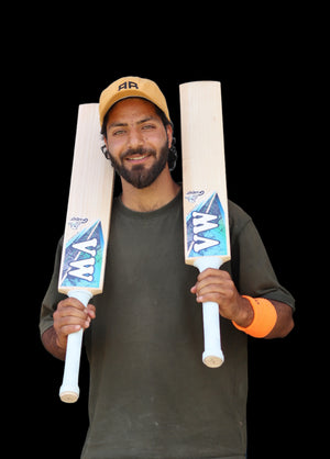 cricket player holding two ghost edition premium kashmir willow cricket bats